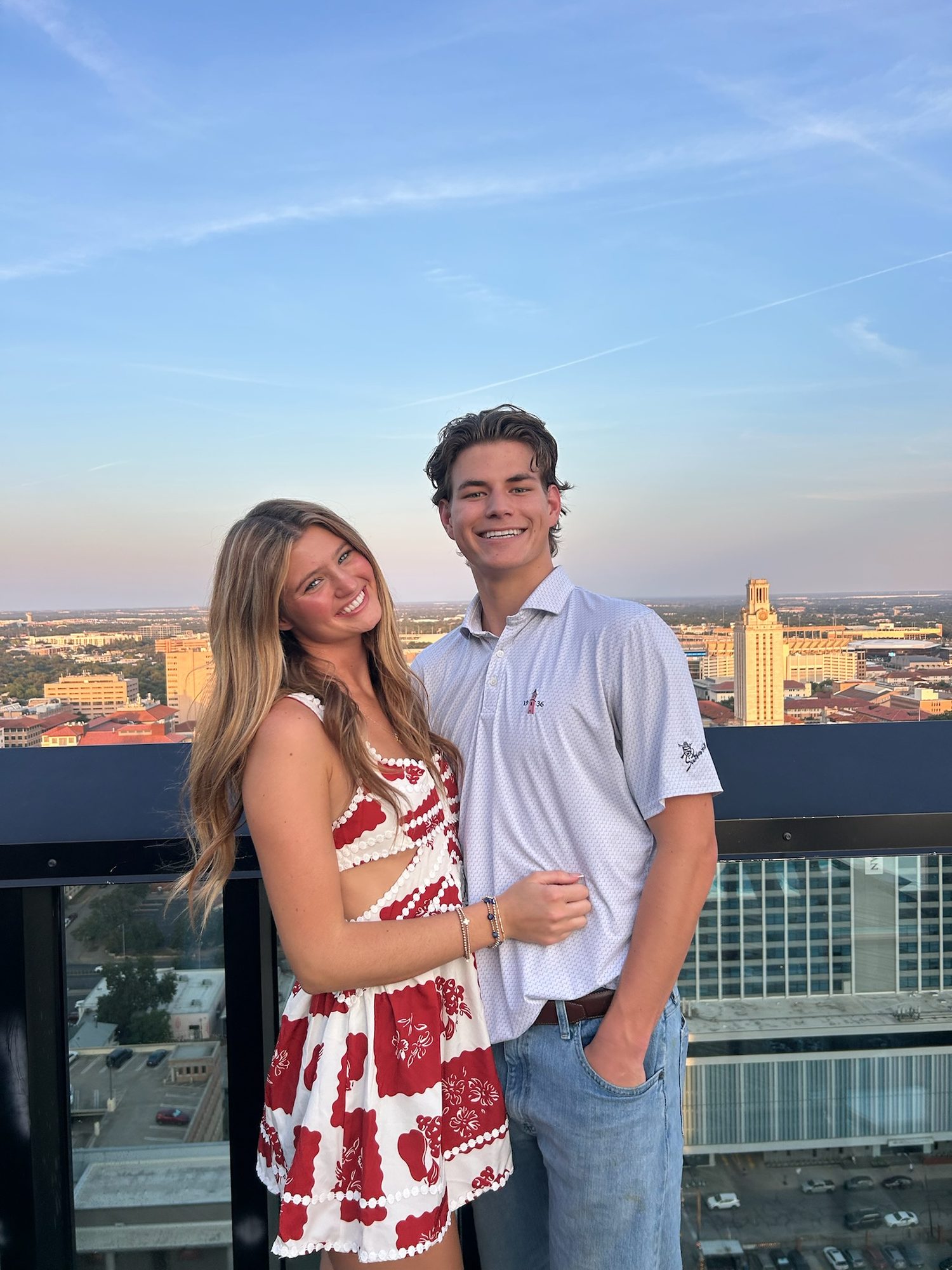 Brock and Anna on a rooftop overlooking the UT Tower in Austin